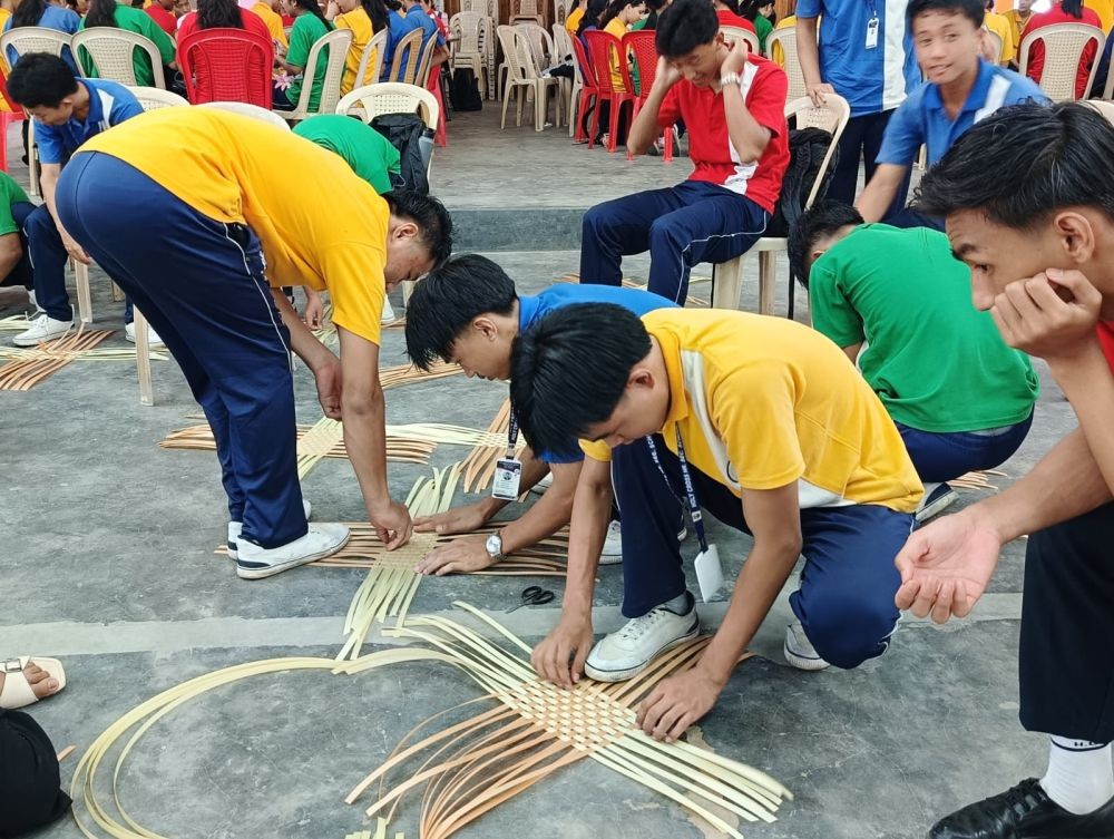 Students of Holy Cross Higher Secondary School, Dimapur, participate in a basket weaving session during the school's two-day Skills Development Workshop held on June 25 and 26.